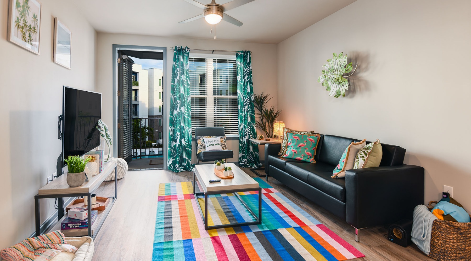 a living room with a couch, tv and a coffee table